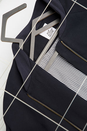 detailed view of dark blue college jacket with striped lining for people with dwarfism