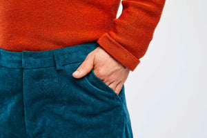 detailed view of hand in pocket of corduroy pants