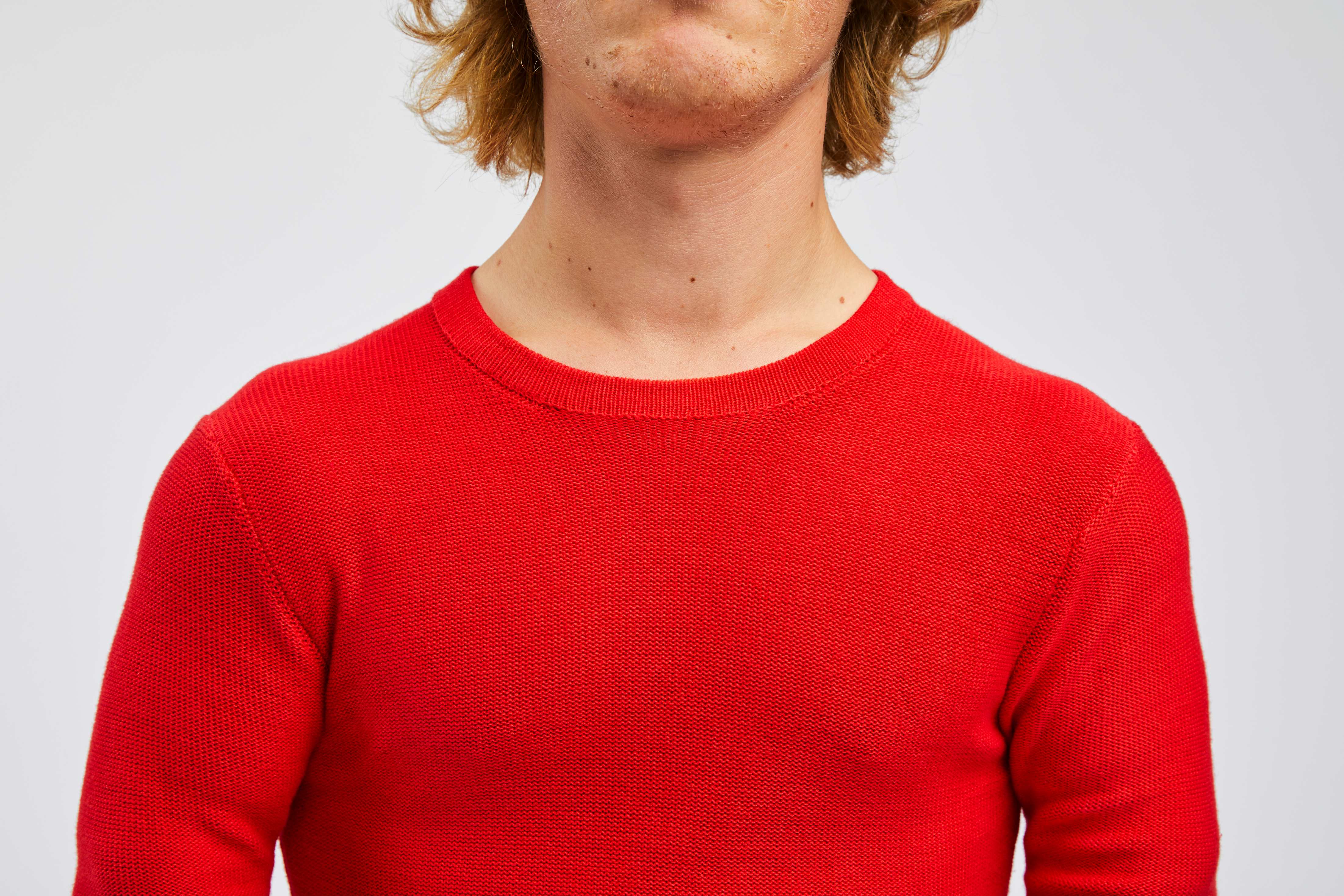 detailed view of red pullovers collar