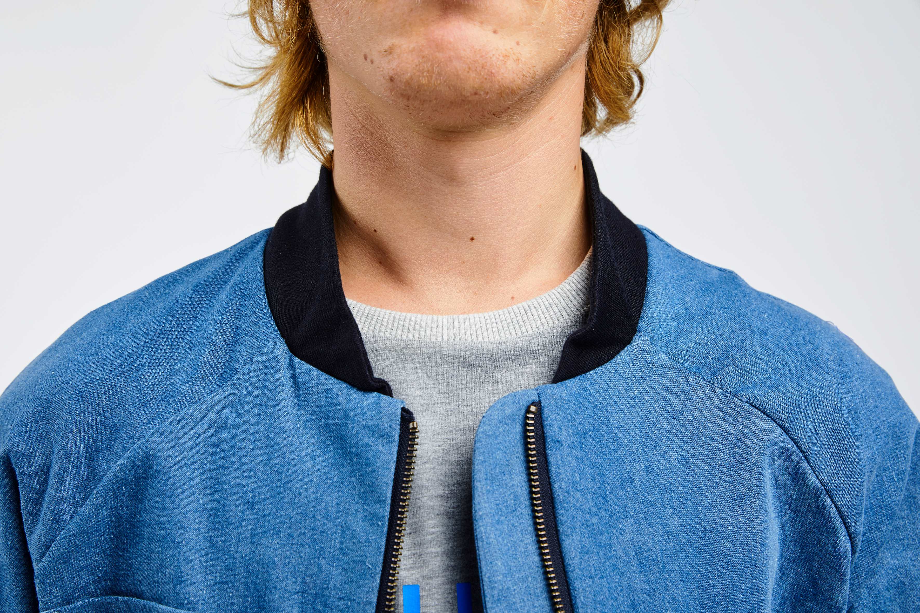 collar of blue college jacket for people with dwarfism