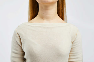 detailed view of collar of white pullover