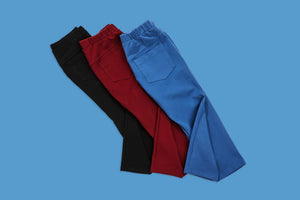 set of red blue and black pants of blue background