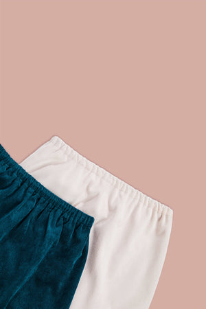 detailed view of white and blue corduroy skirts 