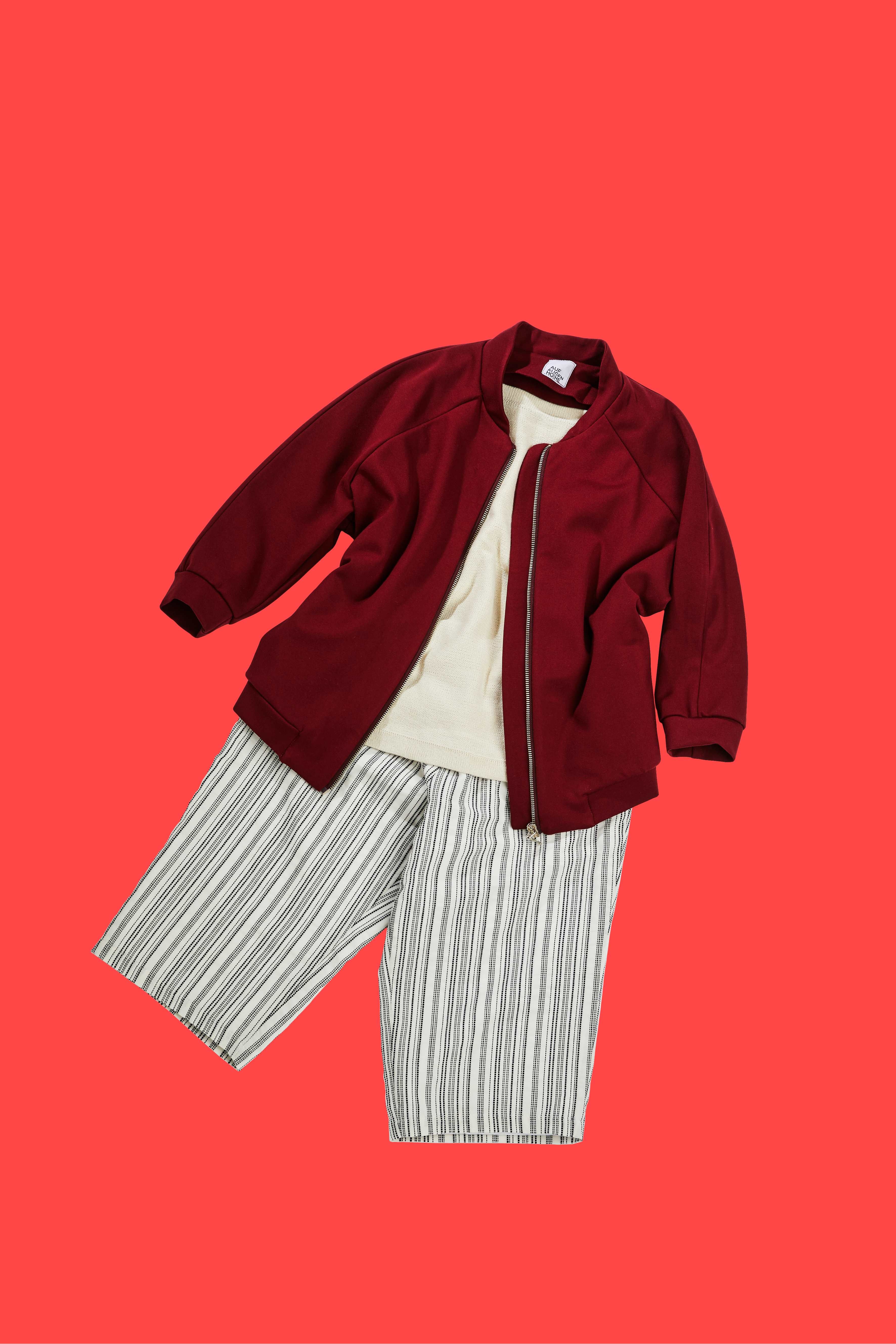 red college jacket and white outfit on red background