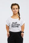 woman with dwarfism wearing white t-shirt with black brand logo
