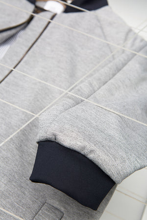 detailed view for blue sleeve on grey college jacket for people with dwarfism