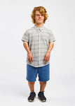 man with dwarfism wearing striped short sleeve shirt in black and white with blue pants