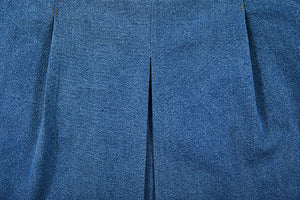 detailed view of folds of jeans skirt