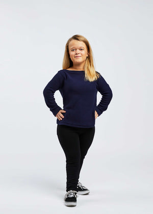 woman with dwarfism wearing dark blue pullover and black pants