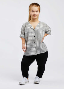 woman with dwarfism wearing white and black striped short sleeved blouse