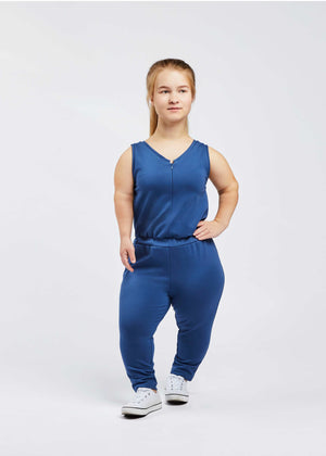 woman with dwarfism wearing blue jumpsuit