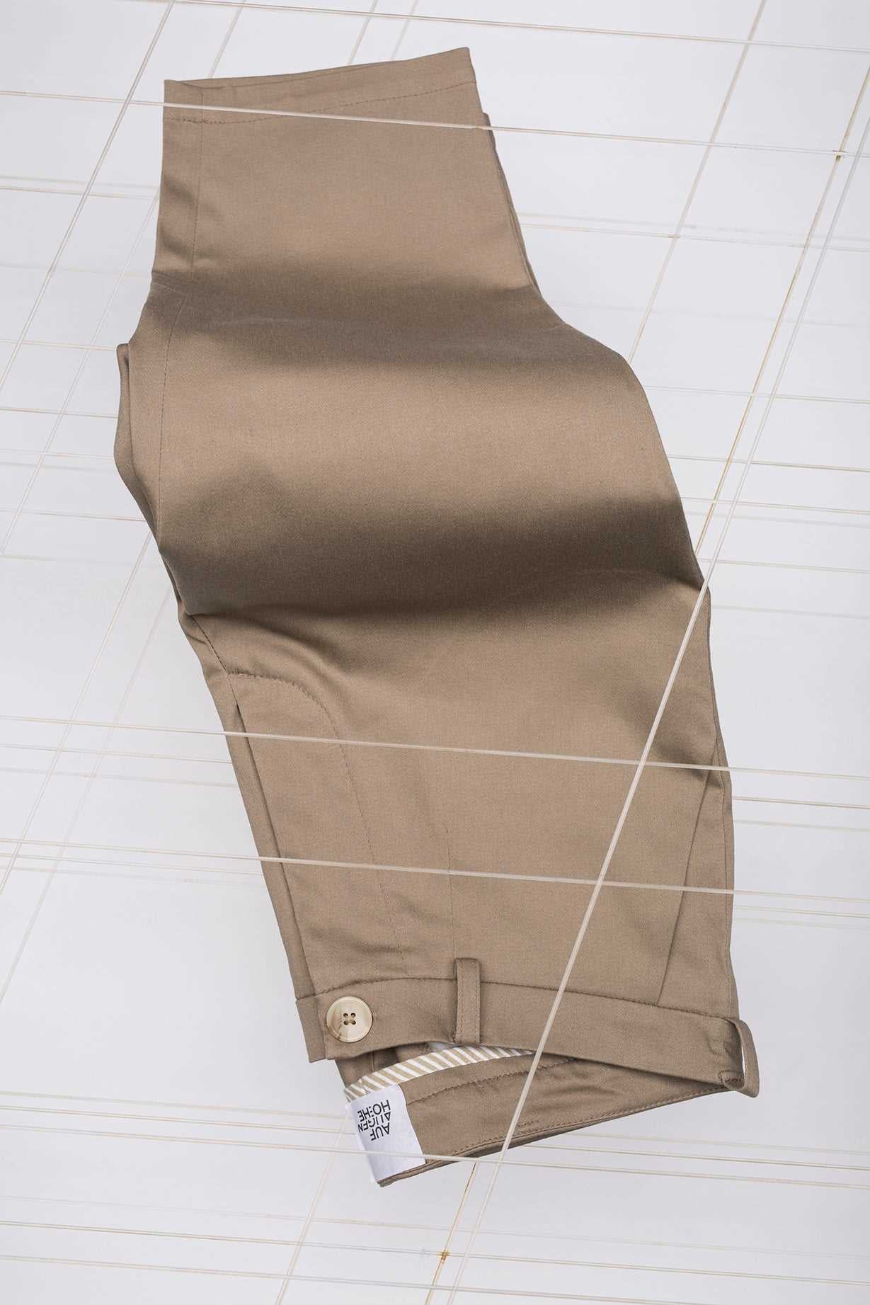 texture of sand coloured pants for little people