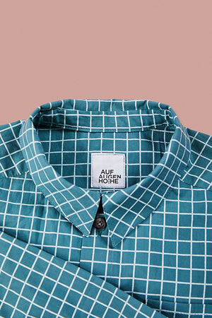 detailed view of blue grid pattern shirts collar 