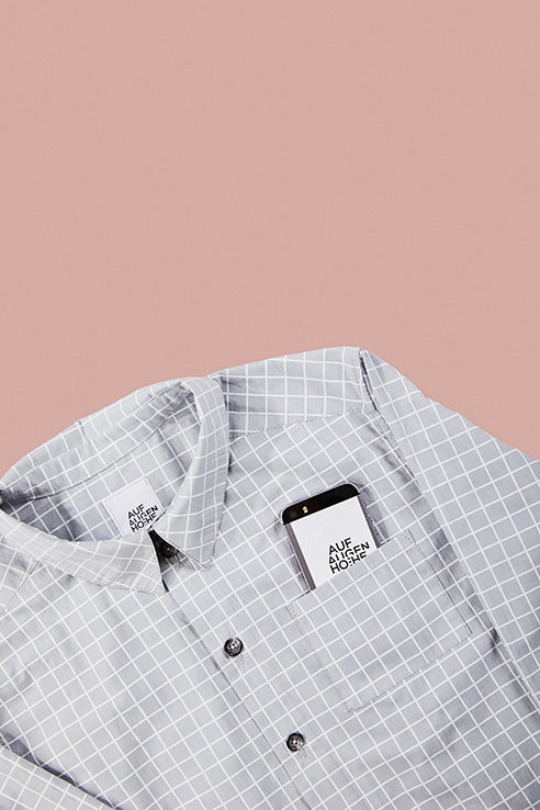 detailed view of grey grid patterned shirts collar